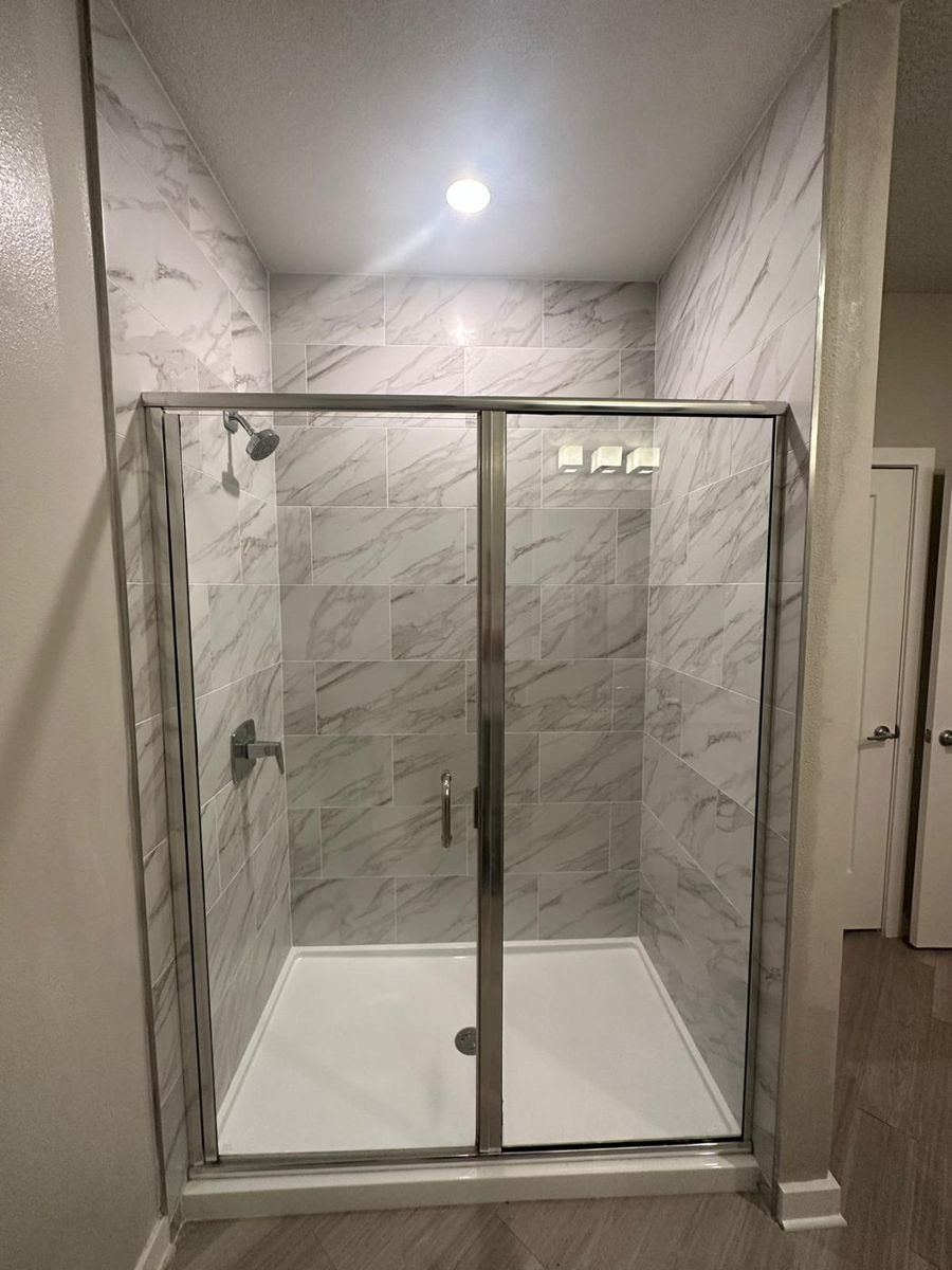 Shower remodel with glass enclosure